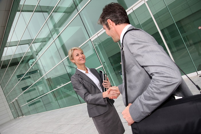 Business people shaking hands after meeting